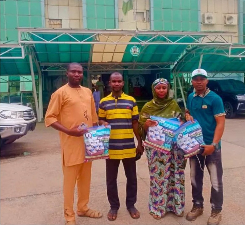 NABSFIPPMN members displaying packs of NABSFIPPMN BSF protein meal outside the Federal Ministry of Environment building, Abuja